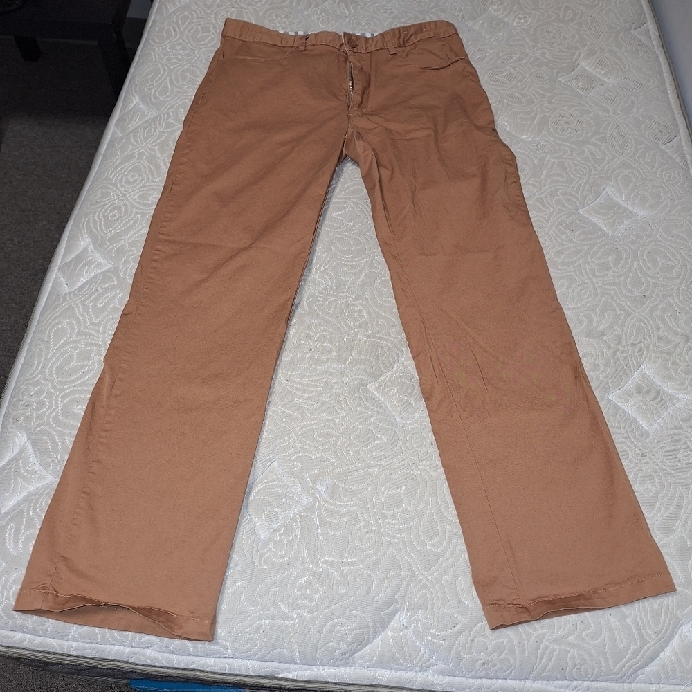 A pair of Kilburne & Finch men's copper color pants in a size 32x30.